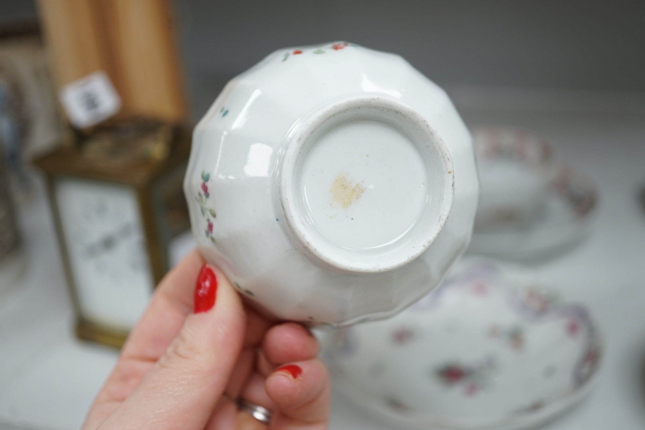 A quantity of Newhall teabowls and saucers and a pearlware tea bowl and saucer, c.1790-1800